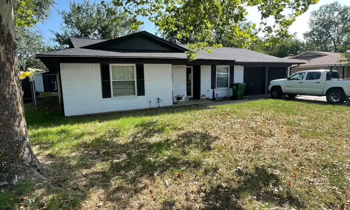 Professional roofing crew working on a residential roof in Frankfort